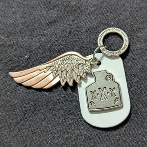 Smuggler's Moon Silver Copper Tone Wing and White Leather Moonshine Tag Keychain
